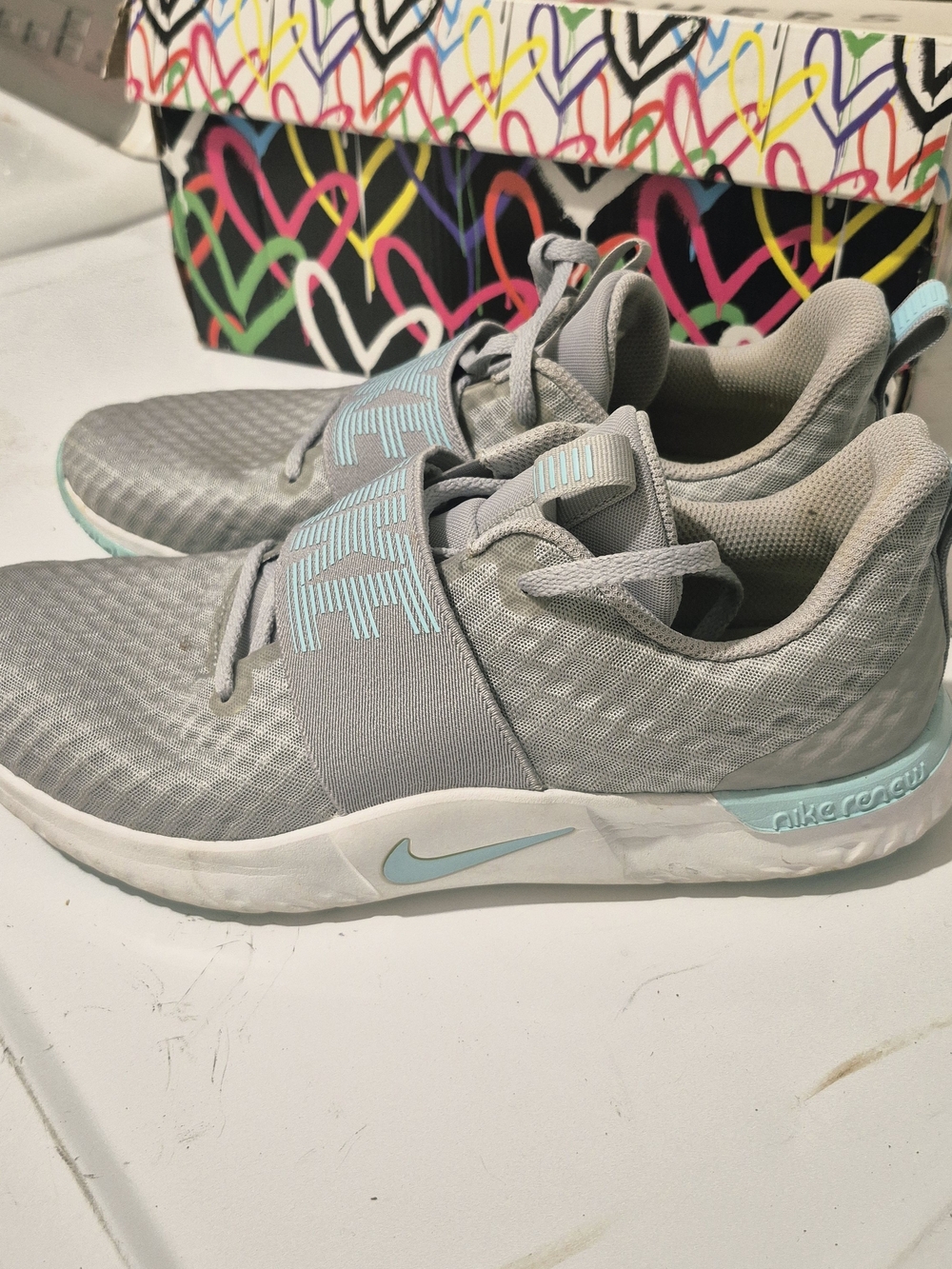 Nike Women’s Light Gray & Light Blue Slip-On Training Sneakers